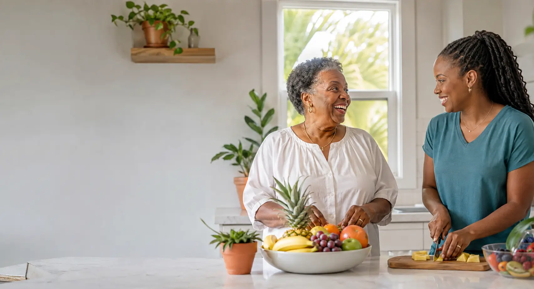 An older adult and caregiver sharing an everyday kitchen activity